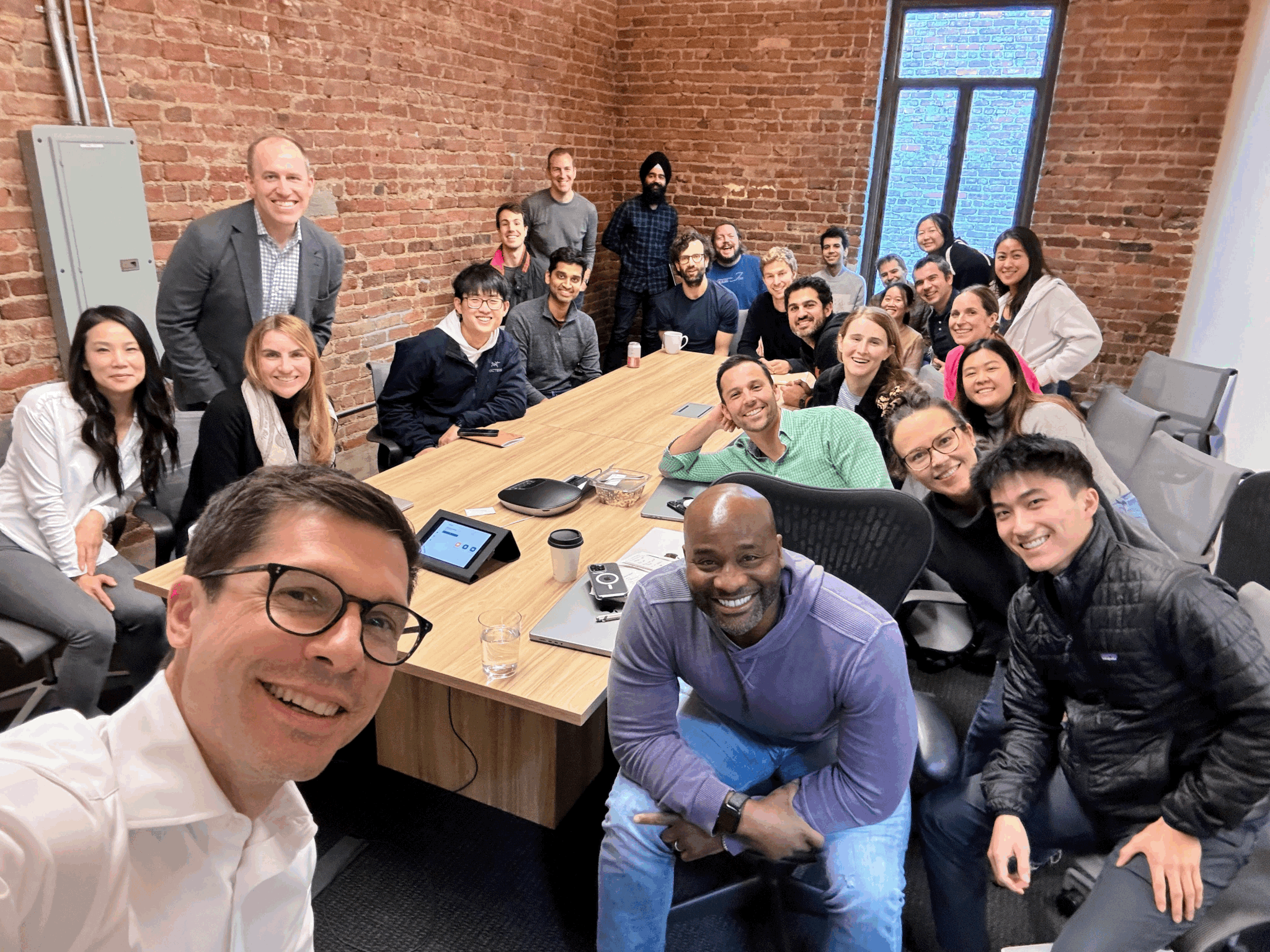 Sierra staff members taking a group photo in the office