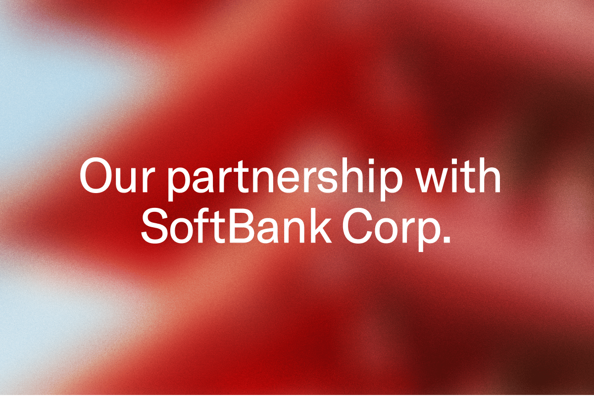Our partnership with SoftBank Corp. on a blurred red background