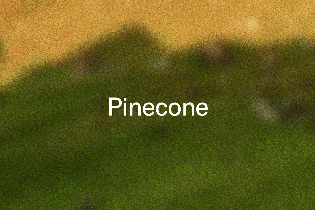 "Pinecone" on a blurred green and yellow background