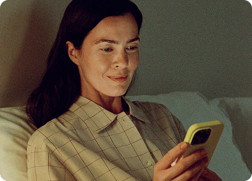 Woman on her phone in bed