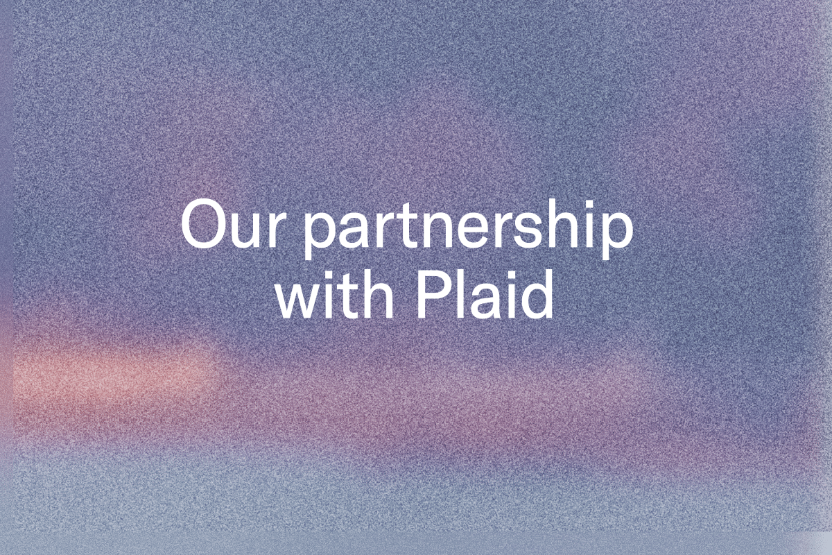 Our partnership with Plaid on a blurred purple and blue background