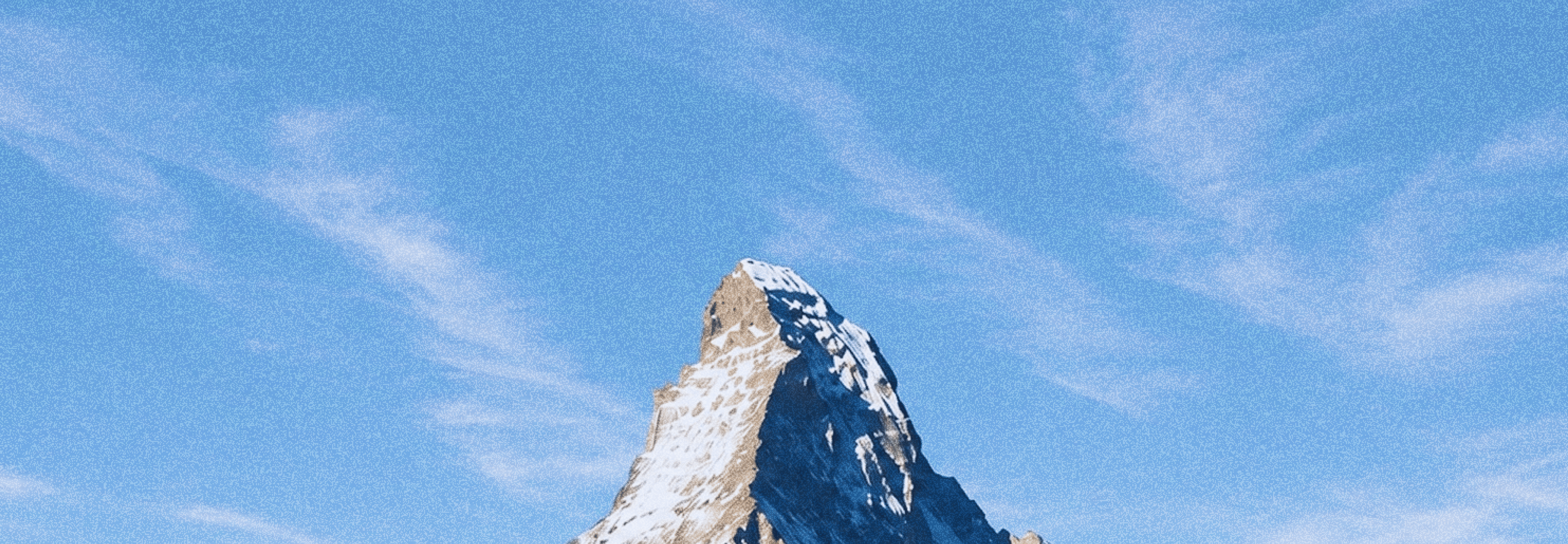 the matterhorn Mountain against a sky with clouds