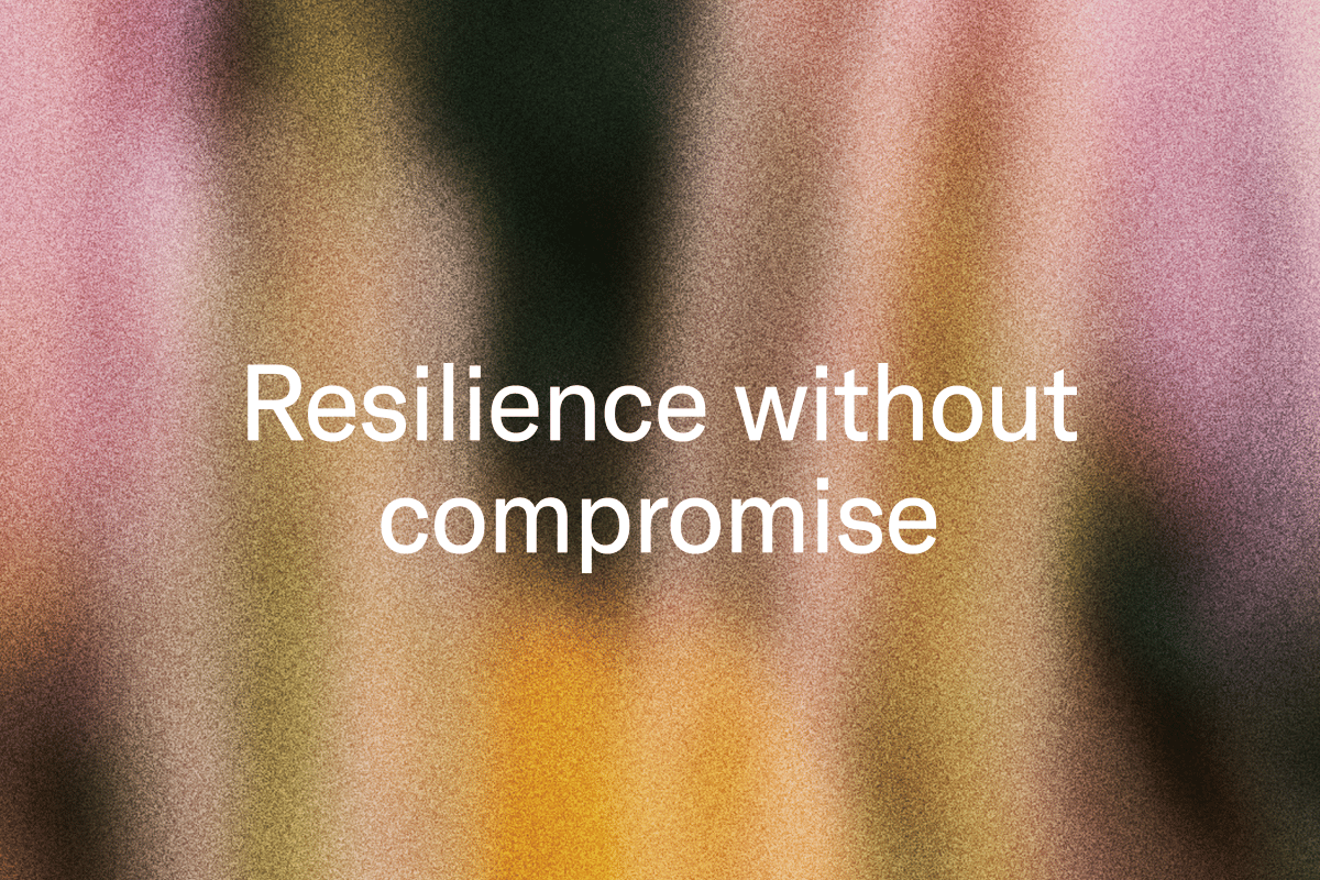 White text "Resilience without compromise" on a blurry, grainy background with vertical streaks of pink, orange, and dark colors.