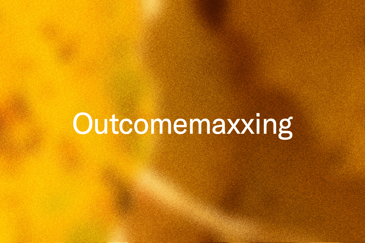 White text "Outcomemaxxing" on a blurry yellow and brown background.