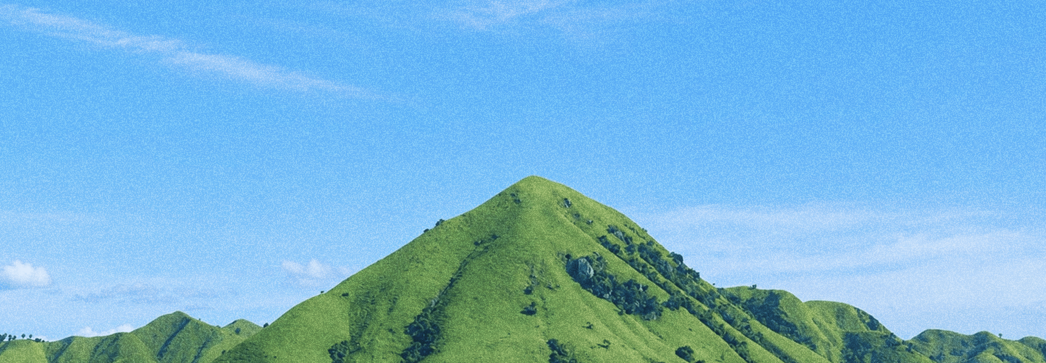 Mountain against a sky with clouds