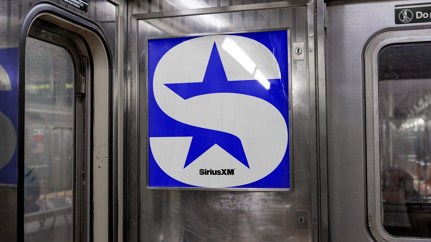 SiriusXM logo poster inside a train 