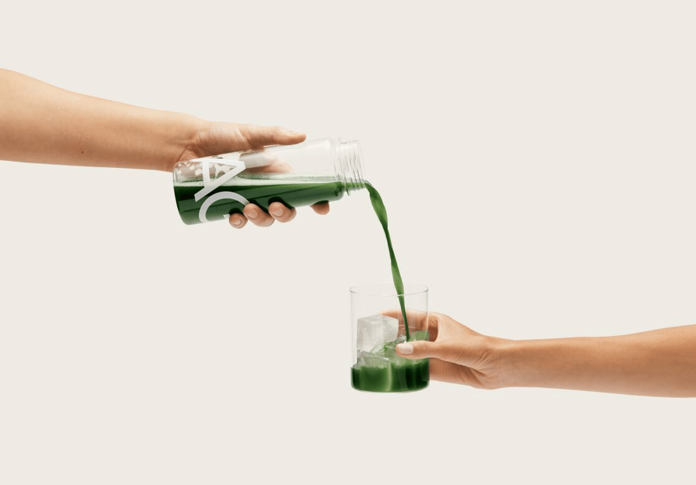 Pouring AG1 into a glass