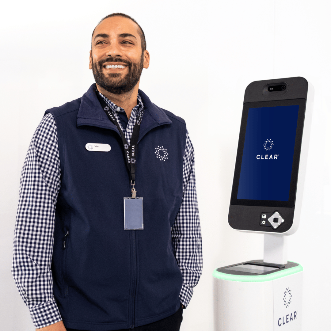 CLEAR Ambassador in front of membership console